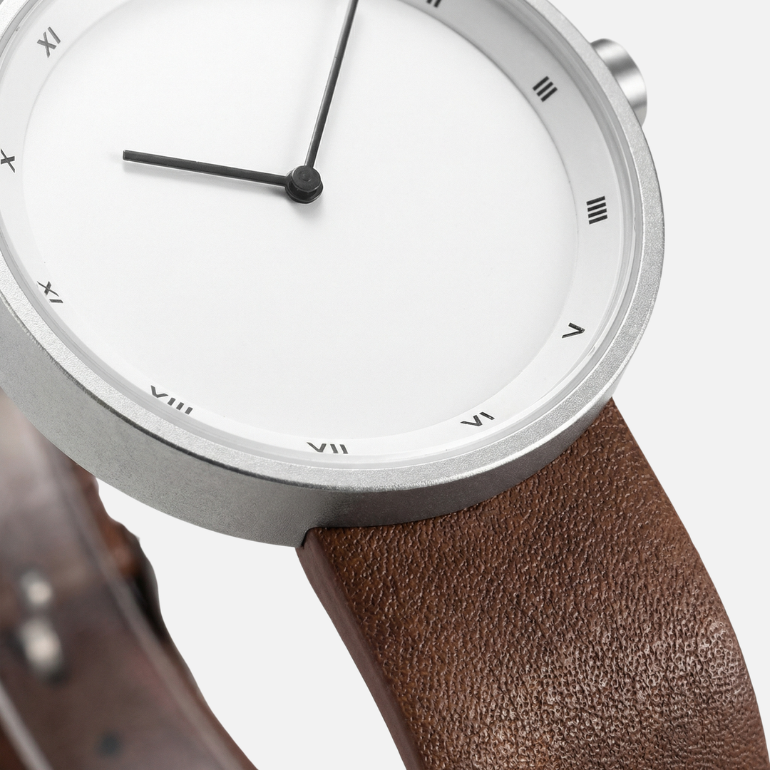 Minimalistische Armbanduhr mit rundem Zifferblatt für Herren